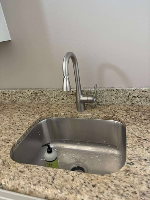 Finished stainless kitchen sink and pull-down faucet installation