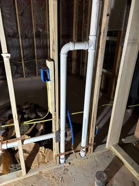 Drain and supply piping installed inside an open framed wall